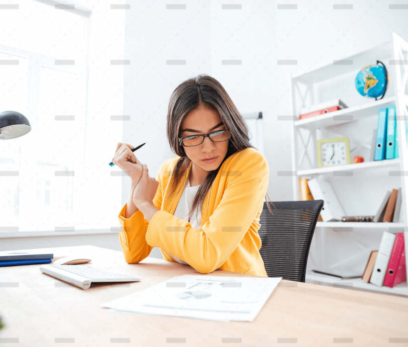 demo-attachment-449-businesswoman-analysing-document-P8WSNMC